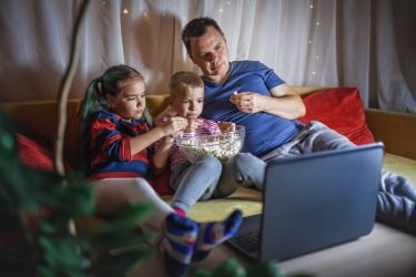 family-movie-night-father-with-kids-watching-movie-with-popcorn-by-laptop-indoor-lifestyle.jpg family-movie-night-father-with-kids-watching-movie-with-popcorn-by-laptop-indoor-lifestyle.jpg